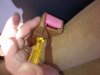 3 Pry Up Front Edge of Red Button...Do Not Pry Open Any Section of The Tan Plastic Seat Belt Hol.jpg